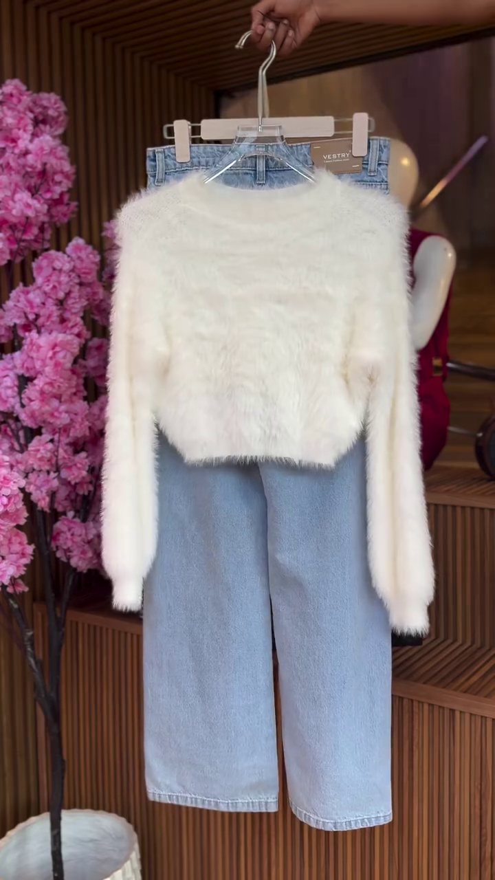 Cozy & Chic: White Fluffy Cropped Sweater with Blue Wide-Leg Jeans