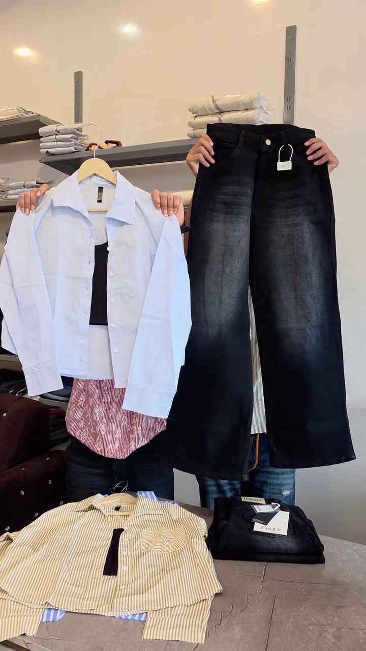 Chic & Contemporary: White Button-Down Shirt with Black Top and Wide-Leg Black Jeans