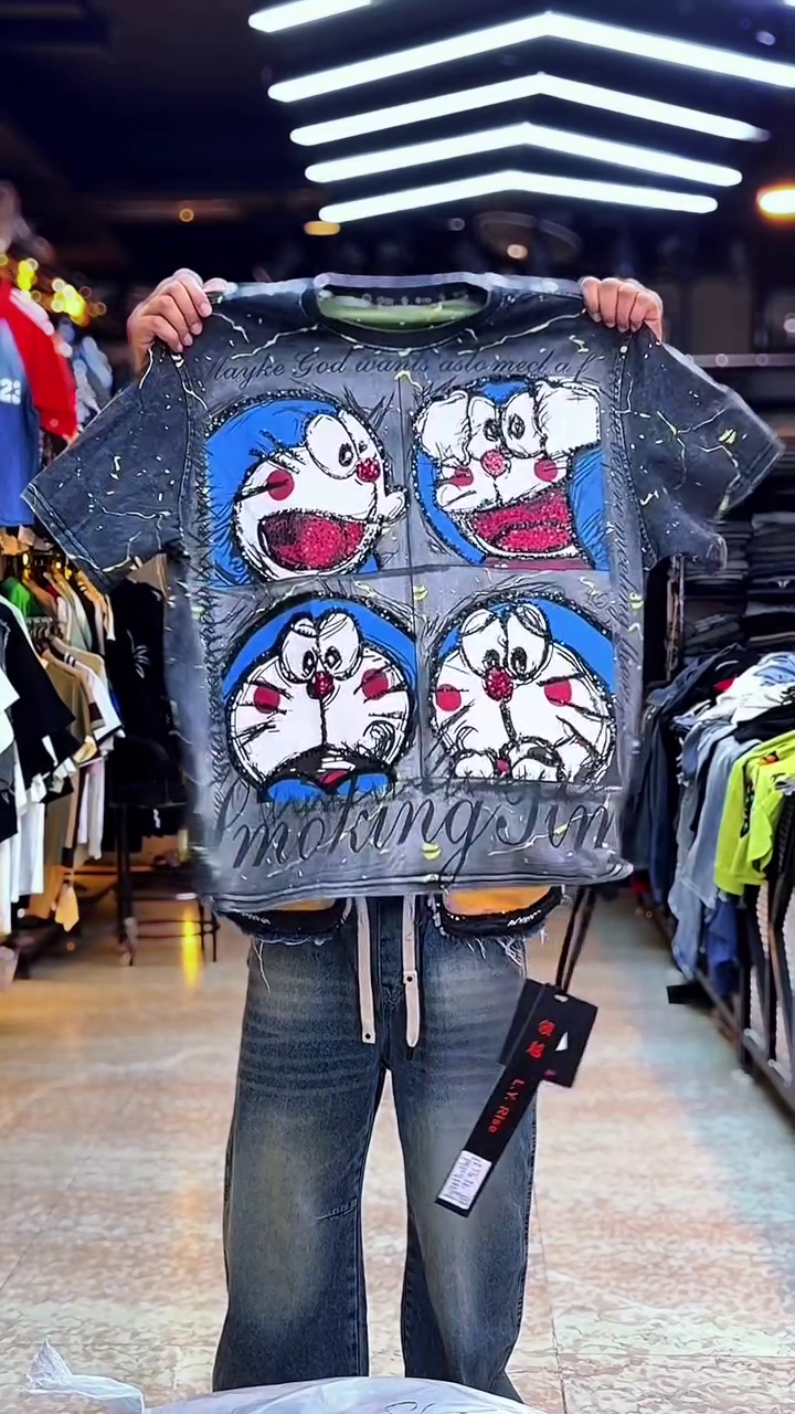 Playful Edge: Doraemon Graphic T-Shirt with “Artist” Print and Distressed Sleeves