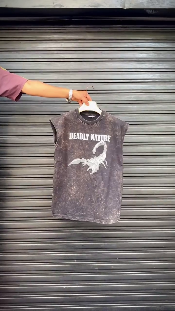 Edgy & Bold: Gray Acid-Wash Sleeveless T-Shirt with Golden Wings and Sword Graphic
