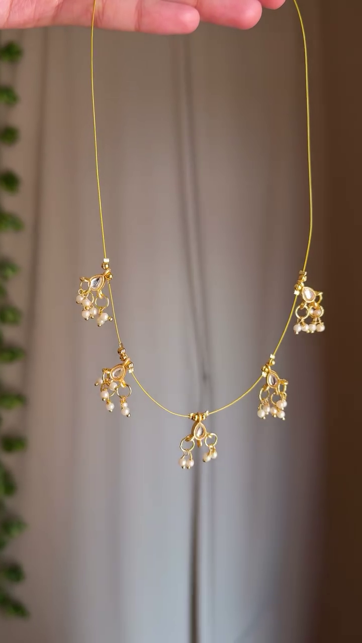 Delicate Elegance: Minimalist Necklace with Pearl Thread and Floral Gem Locket