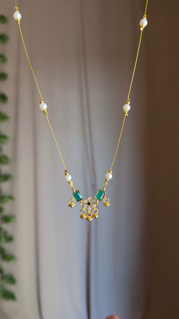 Delicate Elegance: Minimalist Necklace with Pearl Thread and Floral Gem Locket