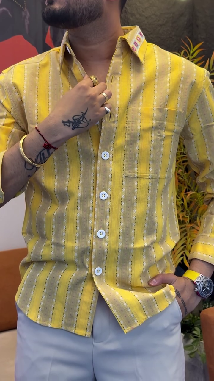 Fresh Summer Style: Yellow & White Striped Linen Shirt Paired with Classic Denim