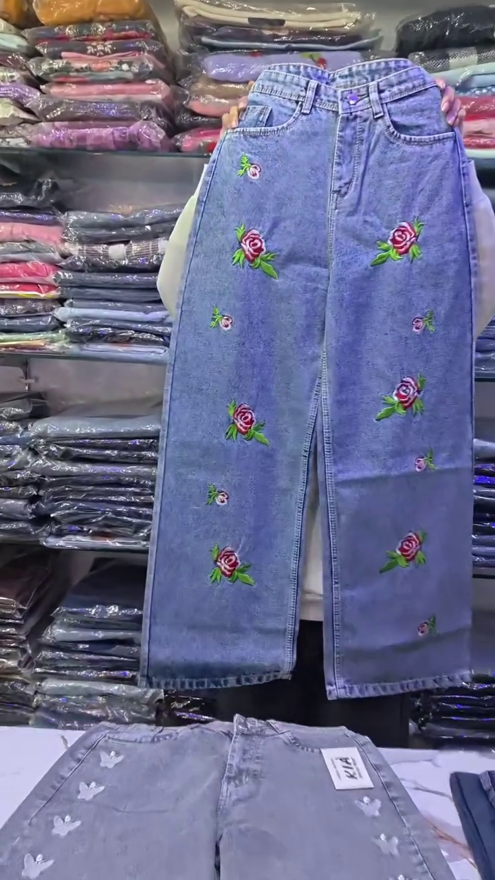 Whimsical Street Style: Wide-Leg Blue Denim Jeans with Butterfly Embellishments