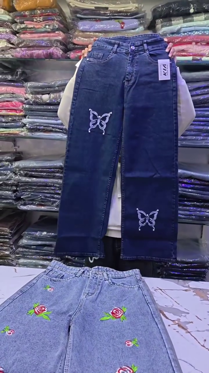 Whimsical Street Style: Wide-Leg Blue Denim Jeans with Butterfly Embellishments