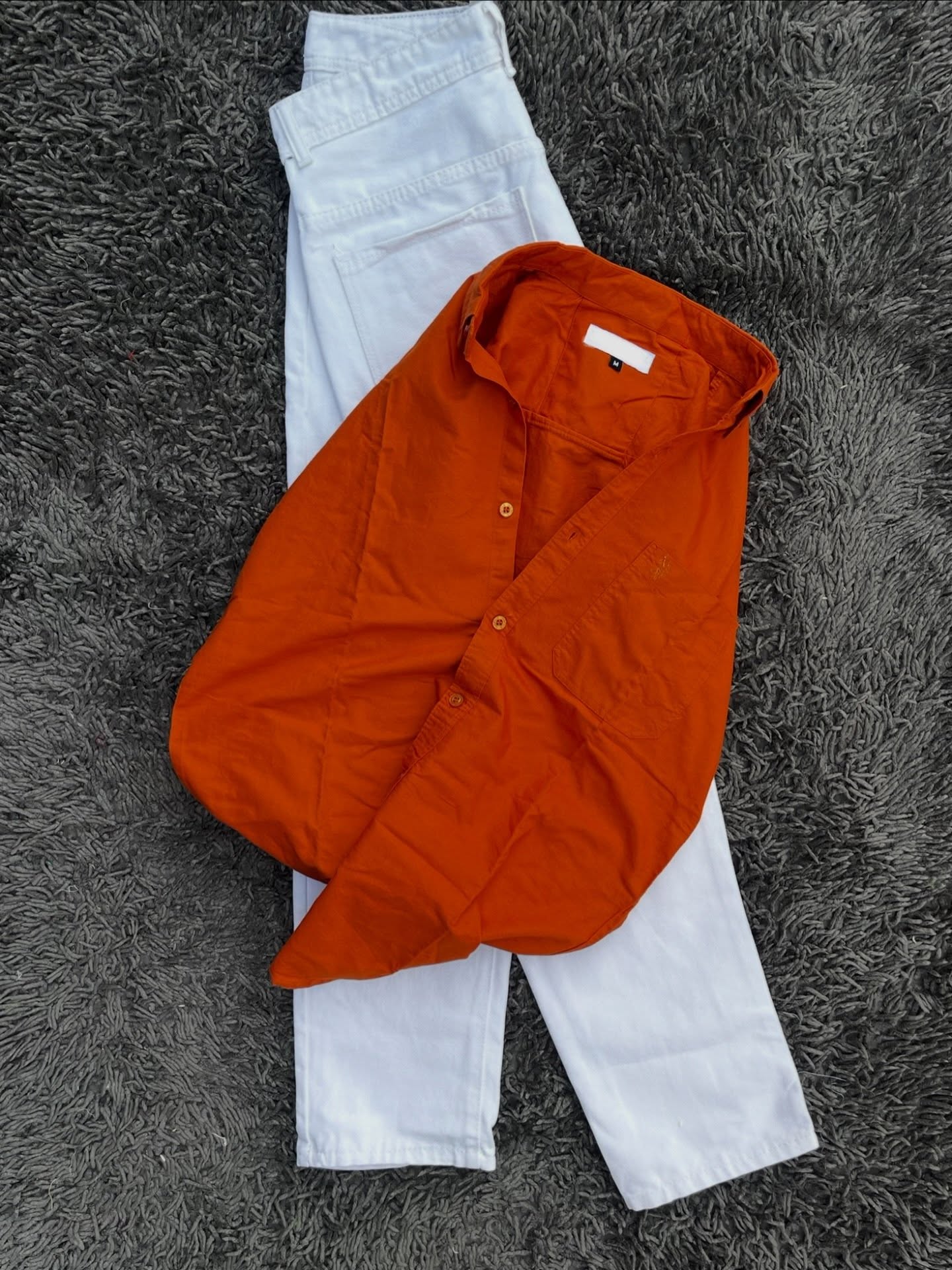 Effortless Earth-Tone Elegance: Rustic Orange Shirt Paired with Crisp White Trousers