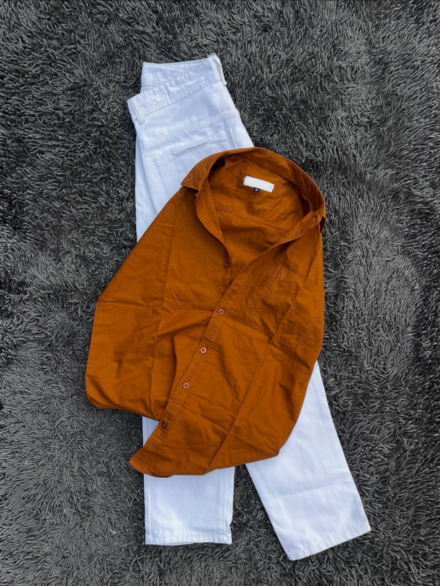 Effortless Earth-Tone Elegance: Rustic Orange Shirt Paired with Crisp White Trousers