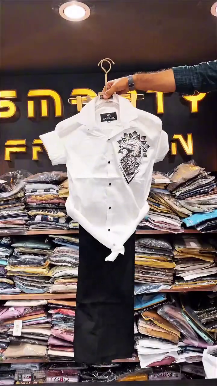 Bold Minimalism: White Eagle Print Shirt Paired with Trousers