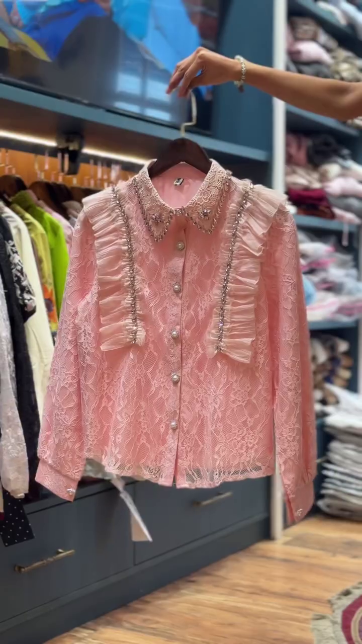 Romantic Elegance: Pink Lace Top with Ruffles and Pearl Button Detailing