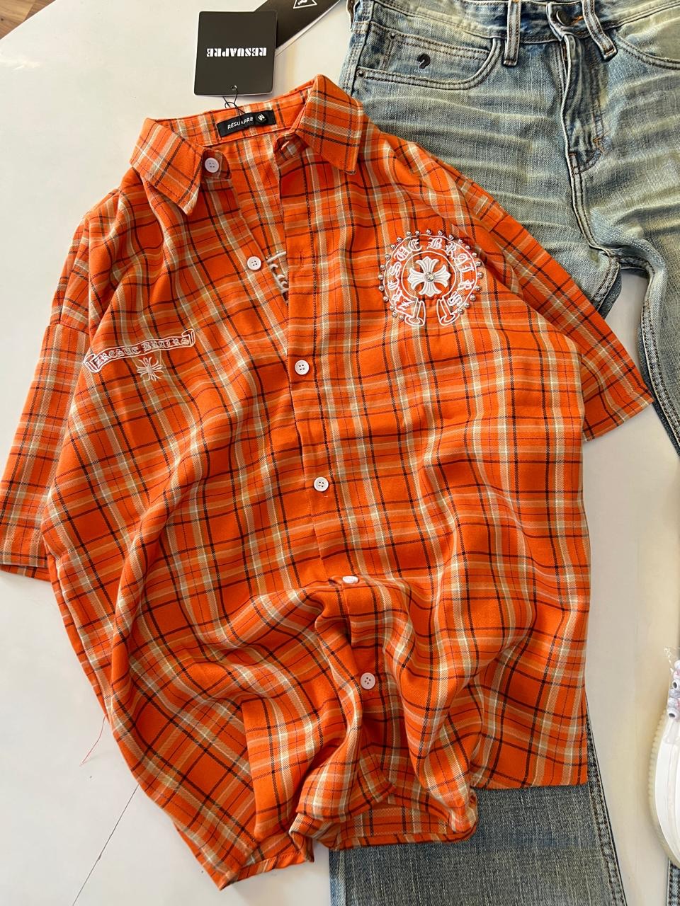 Bold Street Style: Orange Plaid Shirt with Distressed Denim & White Sneakers