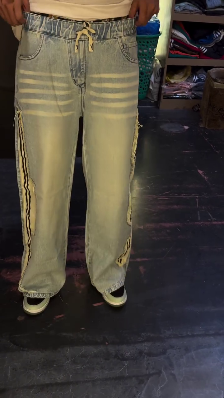 Stylish Light Wash Wide-Leg Cargo Jeans with Striped Side Detail and Utility Pocket Design