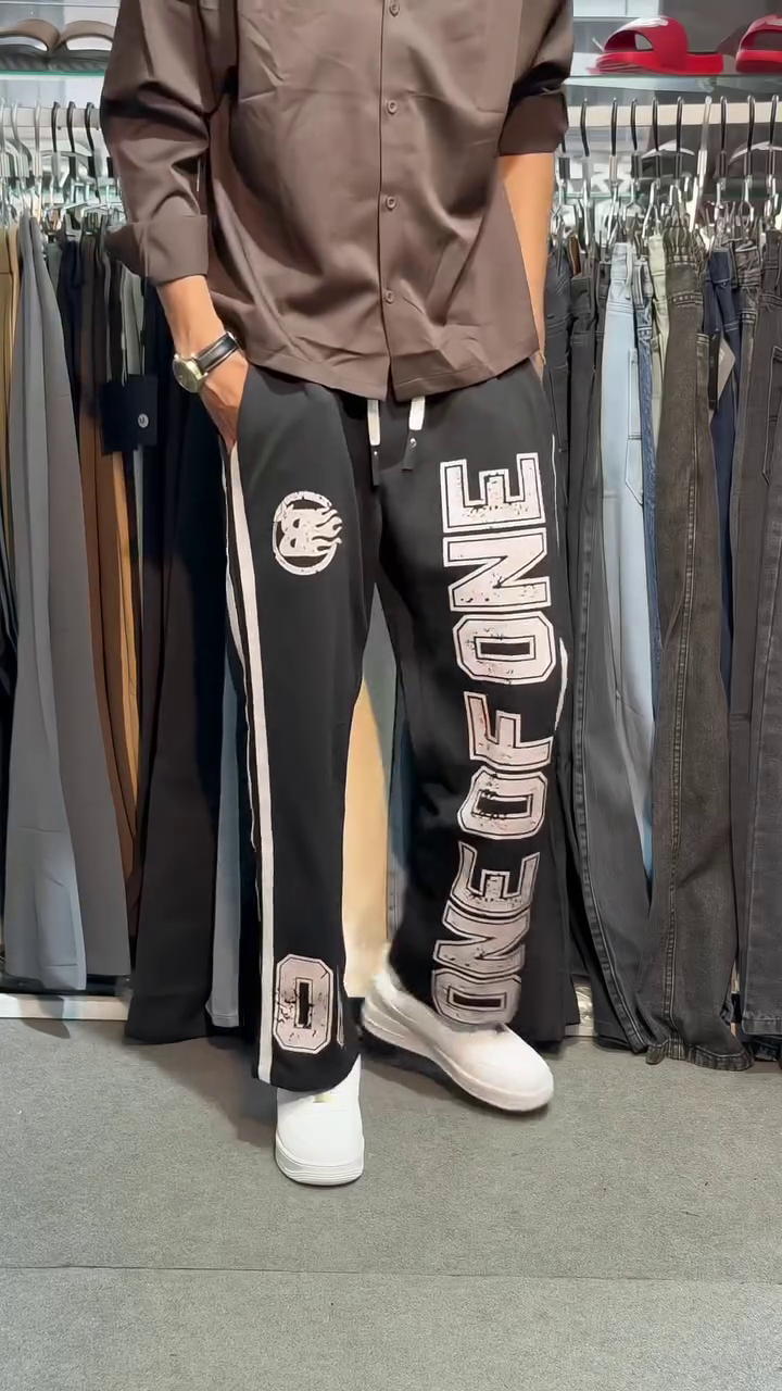 Trendy Wide-Leg Graphic Track Pants with Bold Side Lettering, Contrast Stripes and Relaxed Streetwear Fit