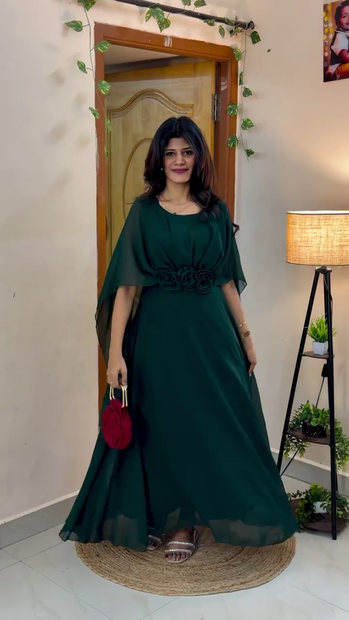 Elegant Maxi Dress with Flowing Cape Sleeves and Floral Waist Detailing for a Graceful Look