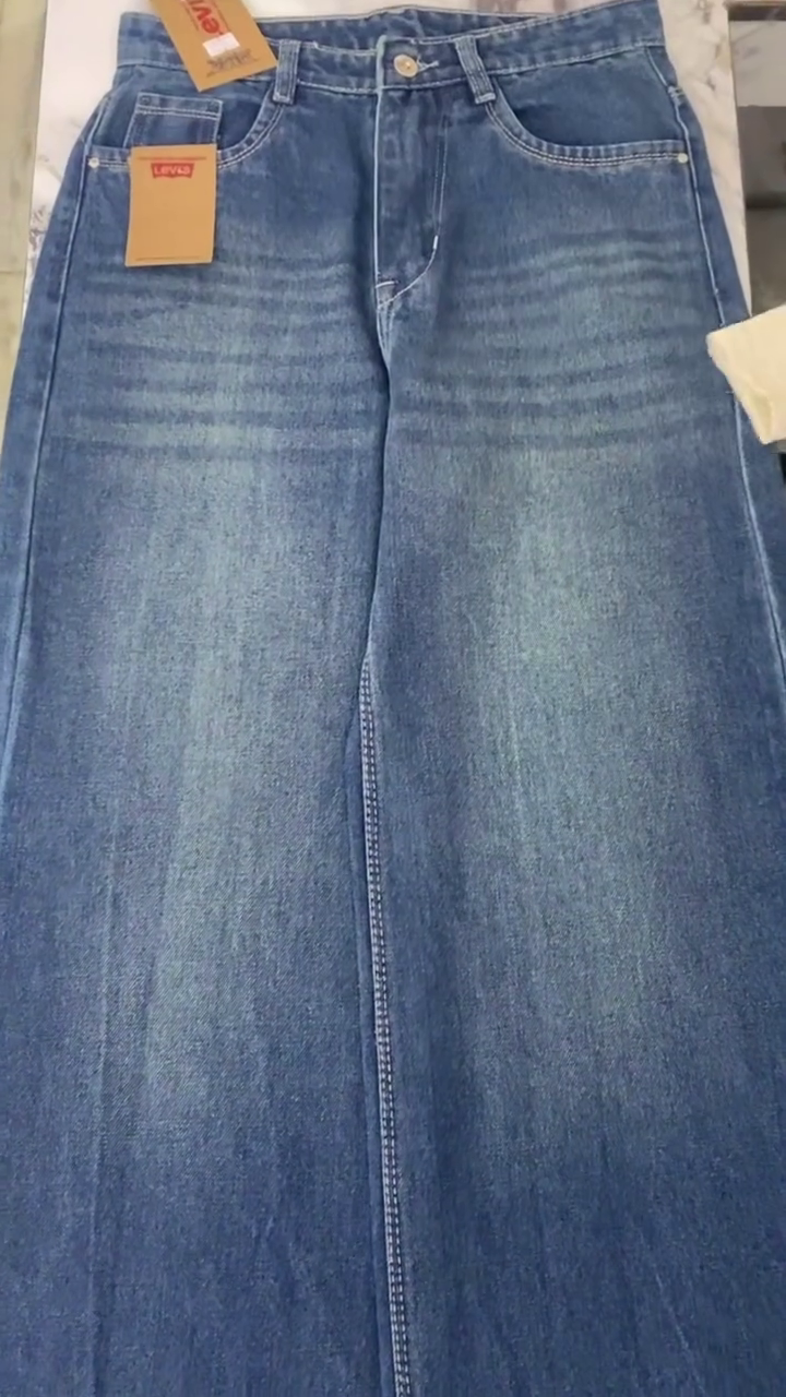Chic White Top and Blue Wide-Leg Jeans – Effortless Everyday Style